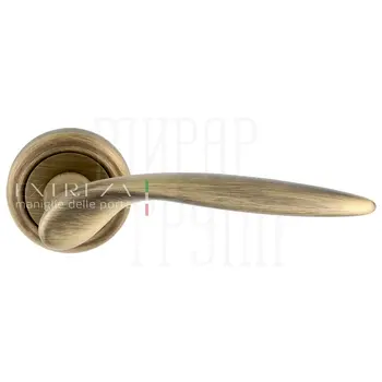 Дверная ручка Extreza 'Calipso' (Калипсо) 311 на круглой розетке R01 матовая бронза