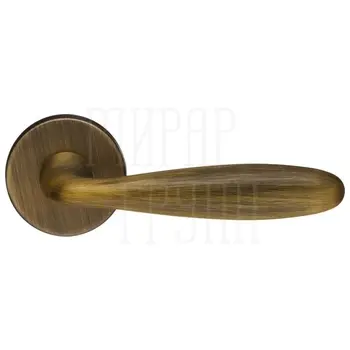 Дверная ручка Extreza HI-TECH 'VIGO' (Виго) 324 на круглой розетке R12 матовая бронза